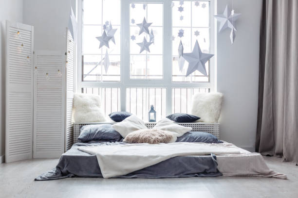 Stylish apartment with large comfortable bed. Room interior