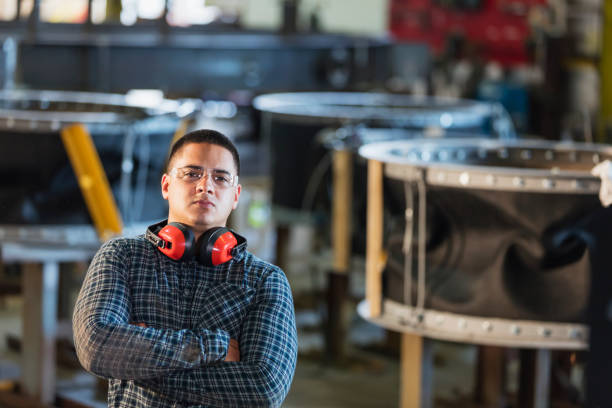 istock Hispanic man in metal fabrication plant 1128757587