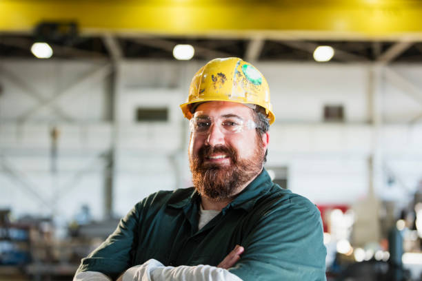 istock Mature man in metal fabrication plant 1128758633