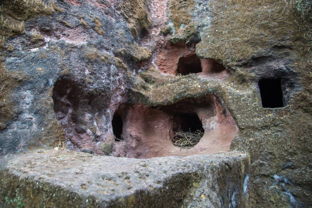 Ethiopia: Church of St. George in Lalibela Holes dug into the surrounding rockface of the Church of St. George (Biete Ghirogis) in Lalibela. the church of saint george lalibela ethiopia stock pictures, royalty-free photos & images