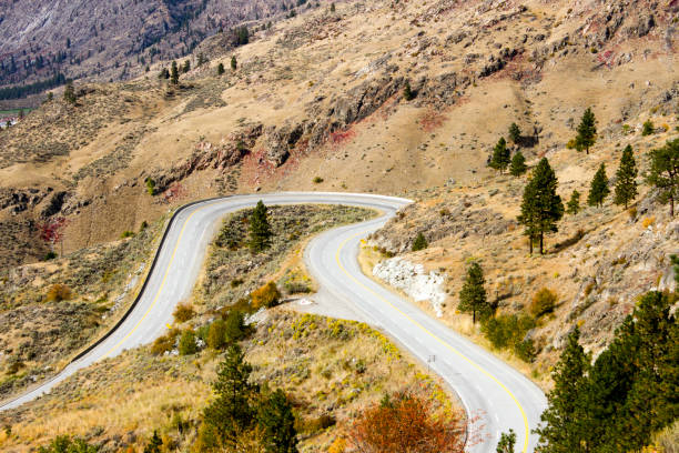 istock Winding Desert Country Road Curve 1128762349