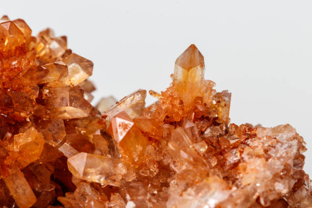 istock Macro of mineral stone Creedite on microcline on white background 1128764119