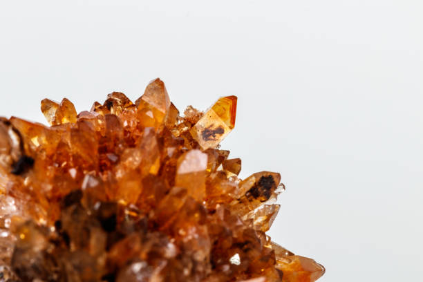 istock Macro of mineral stone Creedite on microcline on white background 1128764125