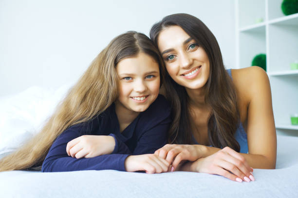 istock Mother and daughter at home 1128765443