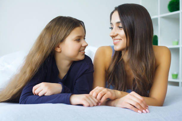istock Mother and daughter at home 1128765505