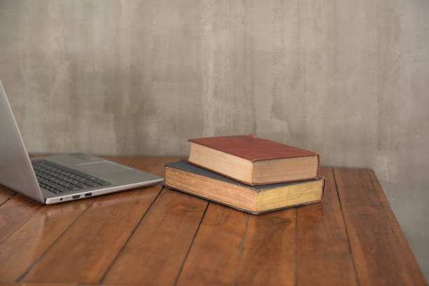 istock Old books open on wooden tables,Concept Vintage. 1128771432