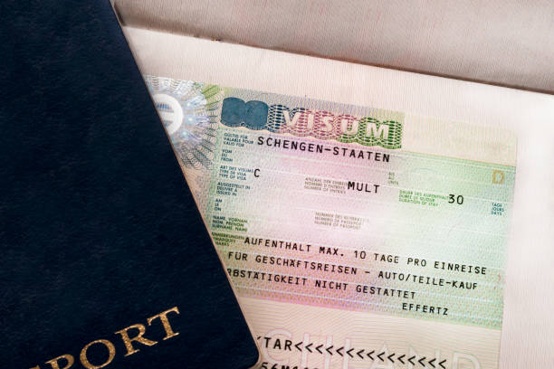Two travelers passports with a Schengen visa. Euro-trip. Selective focus. Two travelers passports with a Schengen visa. Euro-trip. Selective focus schengen agreement photos stock pictures, royalty-free photos & images