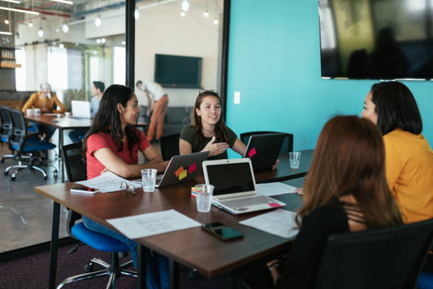 istock Modern millennial women in Latin start-up developing fresh ideas for crowdfunding 1128779306