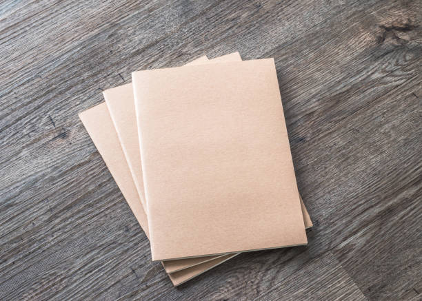 istock Blank book mock up, catalog, magazines or note cover template with recycle brown paper texture on table floor 1128780813