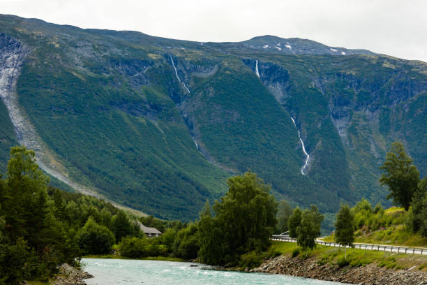 istock Majestic rocky mountains with waterfalls in Norway 1128780883