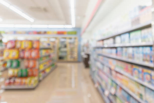 istock Supermarket aisle interior shelves blur background 1128781193