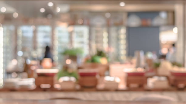 istock Open kitchen blur background in luxury hotel restaurant facility showing chef cooking over blurry food counter for buffet catering service 1128781343