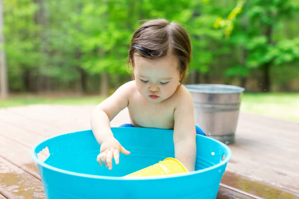 istock Toddler boy playing in a little bath tub 1128782306