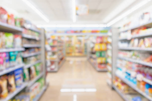 istock Supermarket aisle interior shelves blur background 1128783993