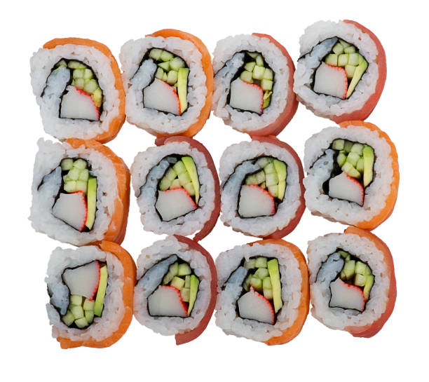 istock Sushi rolls with salmon and tuna on white background 1128786304