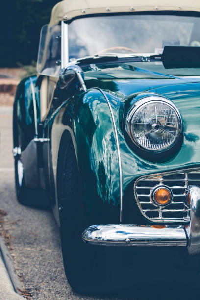 istock Headlights of a green vintage car 1128788385