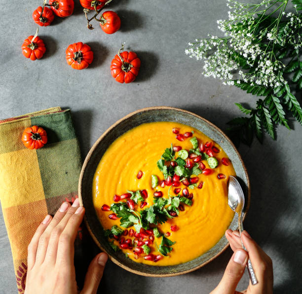istock Fresh pumpkin soup topped with parsley and pomegranate seeds 1128790399