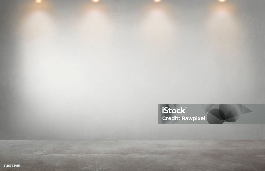 Gray wall with a row of spotlights in an empty room Wall - Building Feature Stock Photo