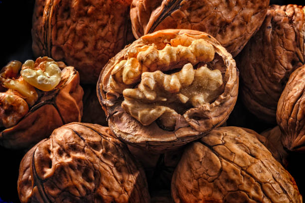 Background close-up of open and close Walnuts stock photo