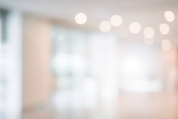 istock abstract blurred inside interior of luxury workplace lobby first floor with neon light bulbs interior background for design concept 1128794532