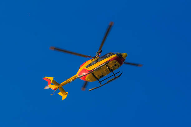 istock Flying rescue helicopter in blue sky 1128804342