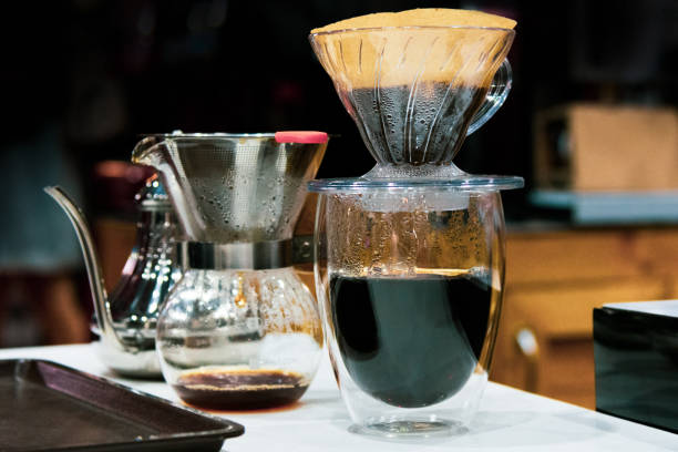 istock Drip coffee brewing, Barista pouring water on coffee ground with filter 1128807951