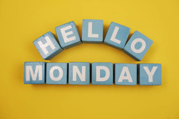 istock Hello Monday alphabet letters on yellow background 1128809239