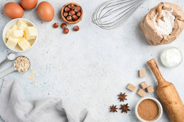 istock Baking ingredients and utensils on concrete background 1128813367