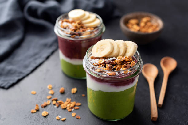 istock Rainbow smoothie with granola, banana 1128813408