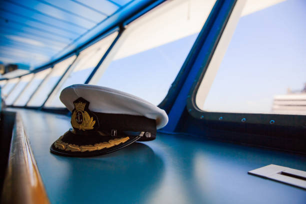 Captain's hat on the ship bridge Captain's hat on the ship bridge sailor hat stock pictures, royalty-free photos & images