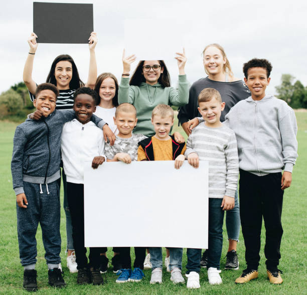 istock Group of diverse kids supporting a movement 1128816250