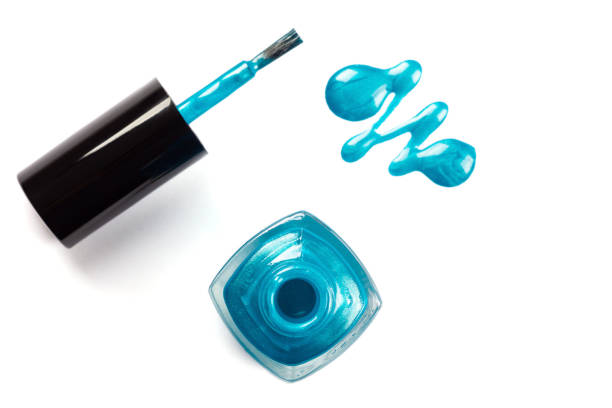 blue nail polish and Spring star flower bouquet with  blue ribbon . Ipheion uniflorum/ blue backgroud