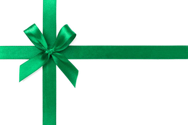 istock Green ribbon with bow isolated on white background. 1128825740