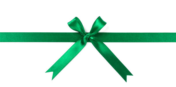 istock Green ribbon with bow isolated on white background. 1128825741