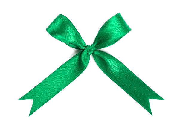 istock Green ribbon satin bow isolated on white background. 1128825744