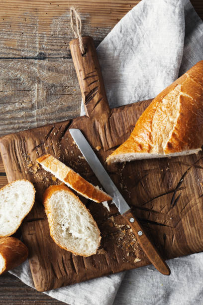istock Sliced French Baguette Bread Wooden Table Bakery 1128832116