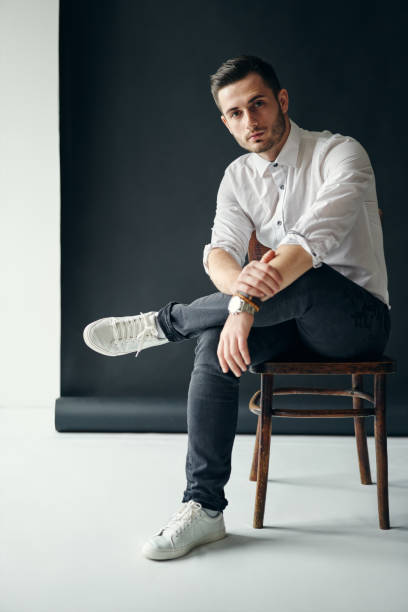 istock Confident handsome man portrait relax on chair 1128832345