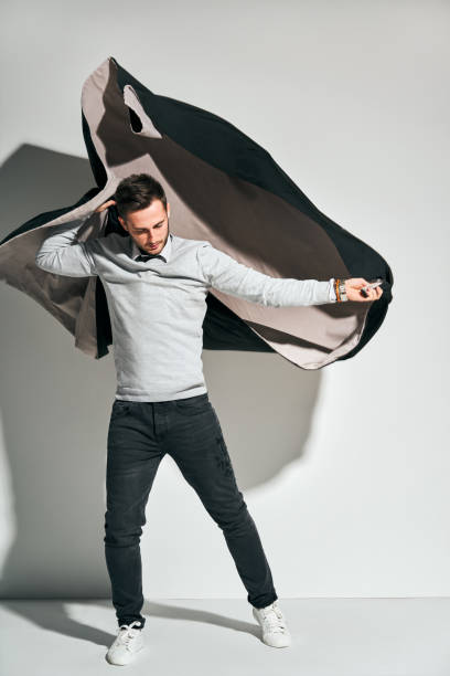 istock Portrait of a handsome man dressing coat in rush 1128832350