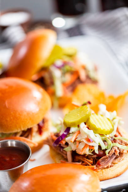 istock BBQ pulled pork sandwich with coleslaw on brioche buns. 1128832677