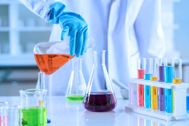 istock scientist with equipment and science experiments, laboratory glassware containing chemical liquid for research or analyzing a sample into test tube in laboratory 1128838994