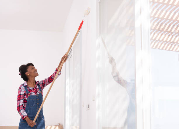 istock Woman redecorating her new home. 1128839030