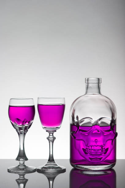 Purple wine bottles isolated on white background