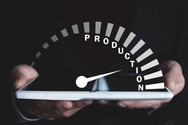 istock Man holding speedometer with Production word. Business concept 1128842350