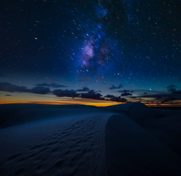 istock Starry night sky over the desert - night landscape 1128843706