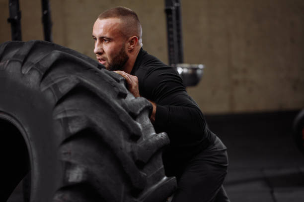 istock serious athlete is pushing the wheel 1128844968