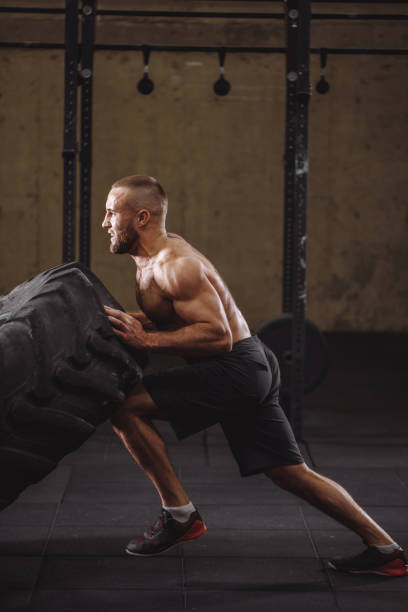 istock fit angry swetaty man is showing his abilities 1128848304