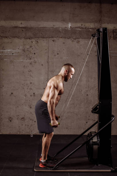 istock young attractive man with ropes is preparing for the competition 1128849027