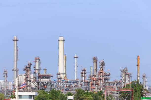 istock Oil refinery tower and chimney 1128853806