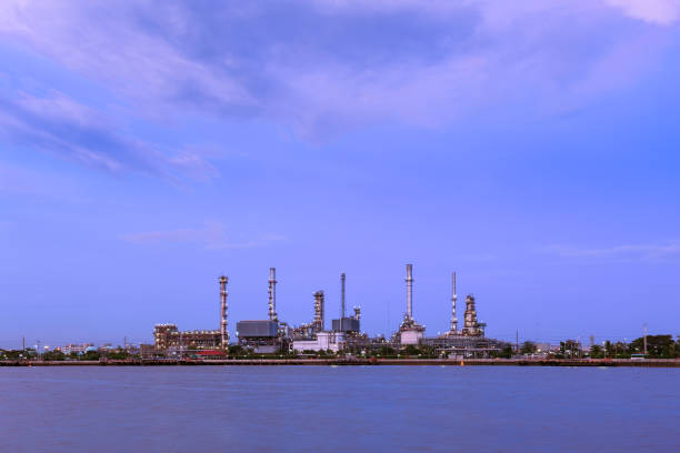 istock Oil refinery on water front at twilight 1128853807