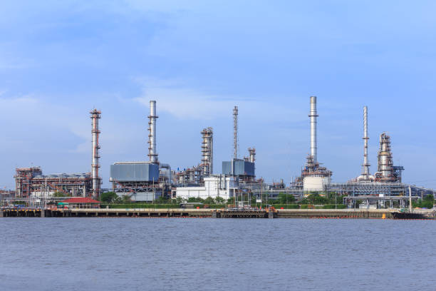 istock Oil refinery tower and chimney 1128853814
